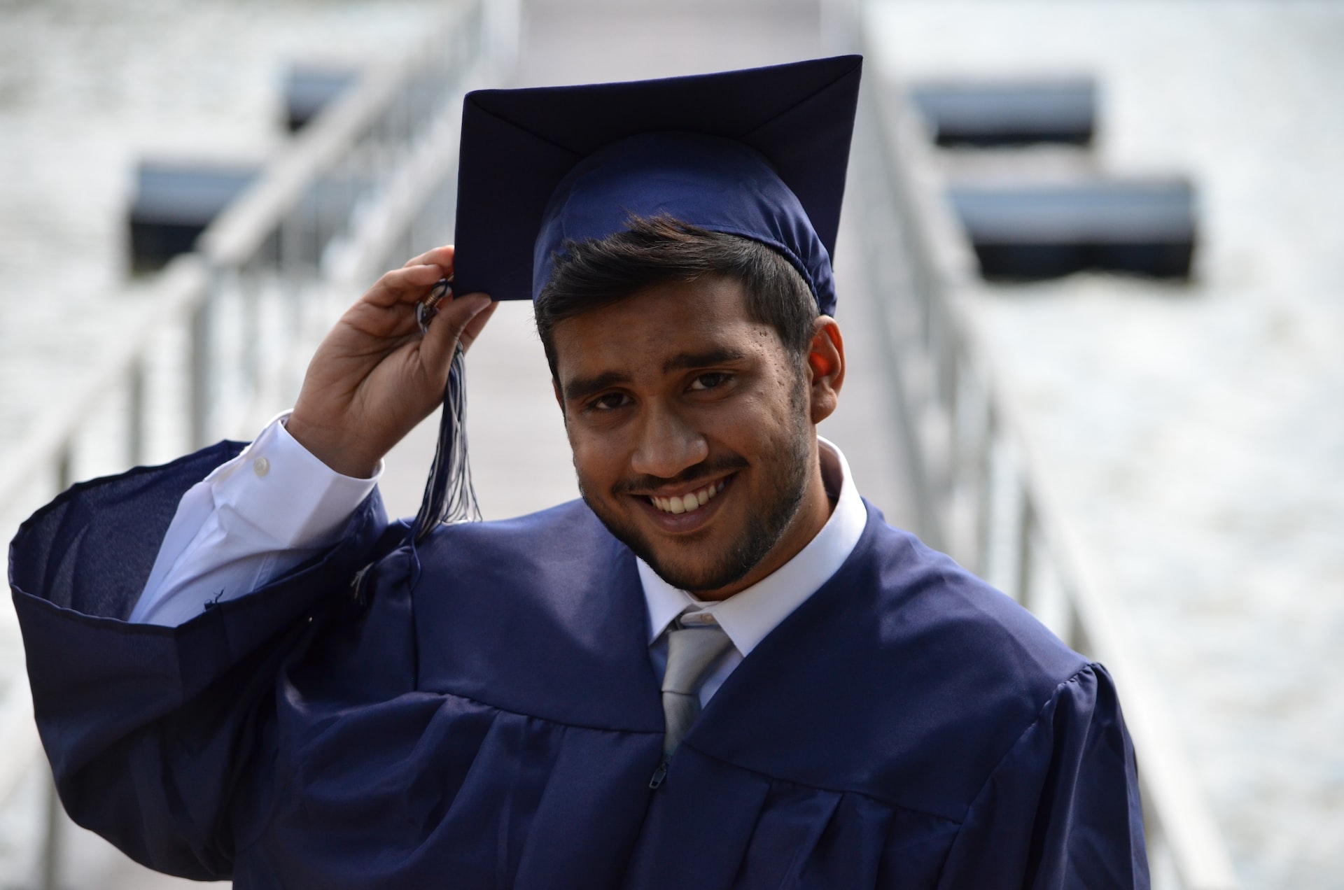 man holding his graduation cap