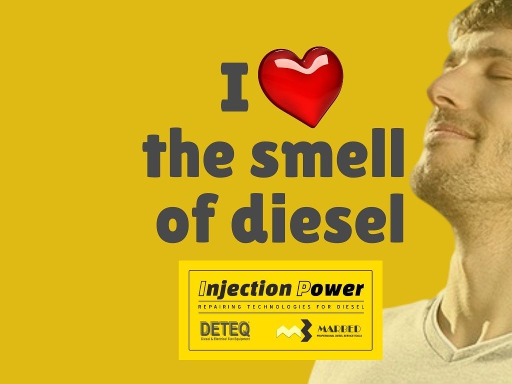 Advertisement showing a man enjoying the smell of diesel, with text "i ❤️ the smell of diesel," and logos for diesel injection power technologies.